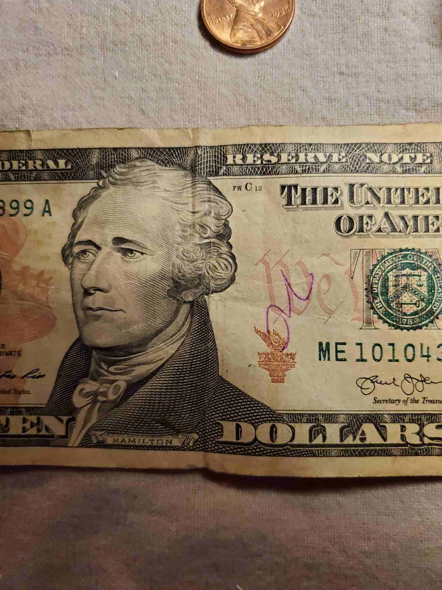 2013-Ten-Dollar-Bill-With-A-Random-Purple-Ink-Spot